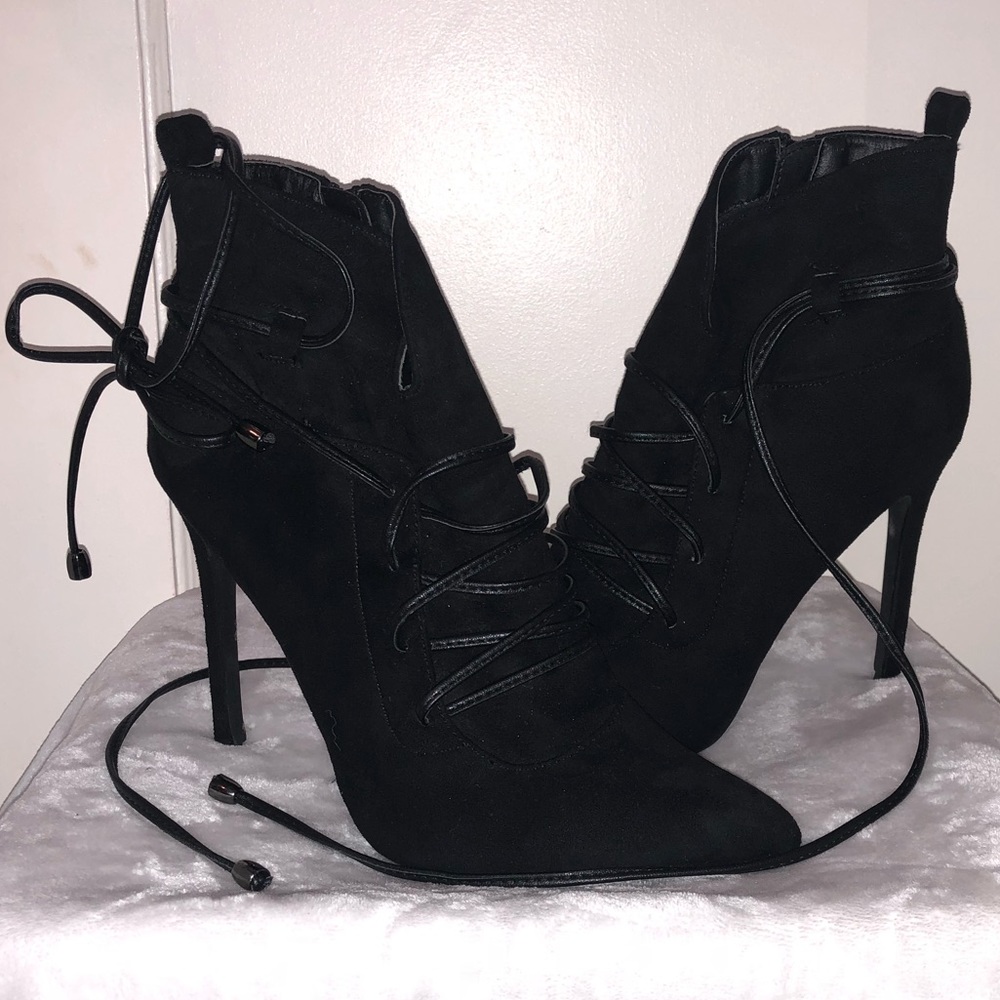 Heeled black booties